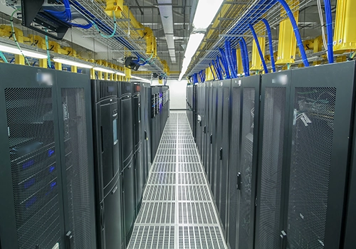 Room with rows of servers in data center. Data Centers.